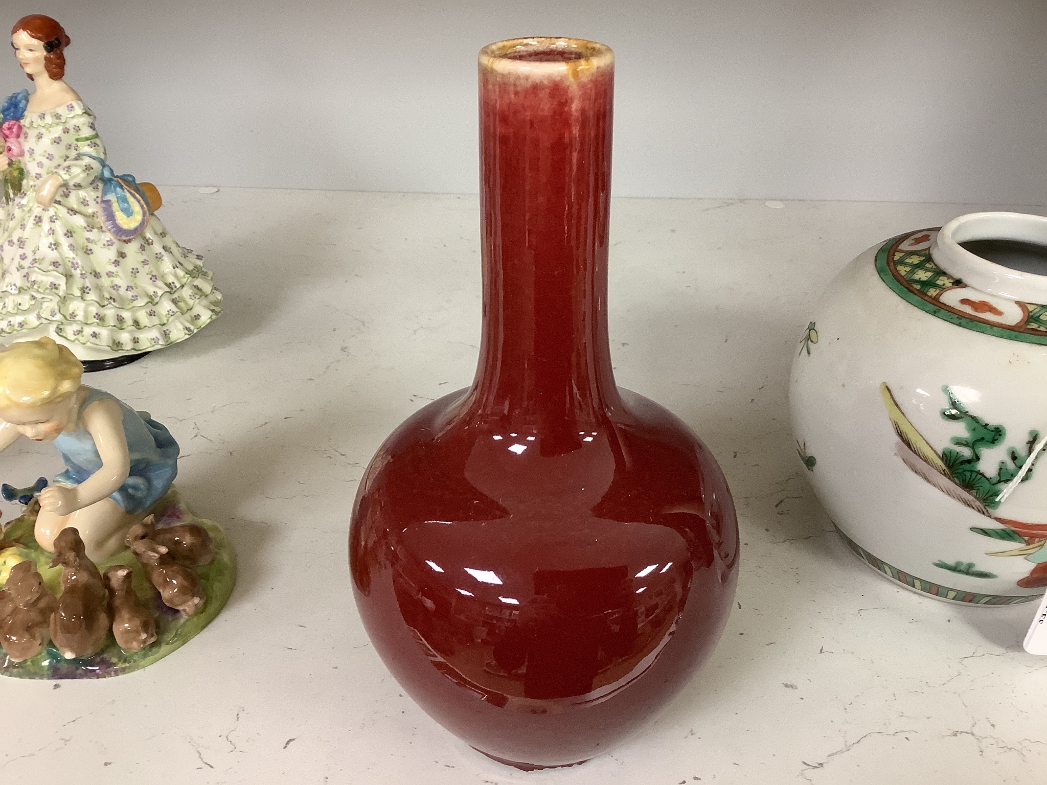 A Chinese famille verte jar and a sang de boeuf vase